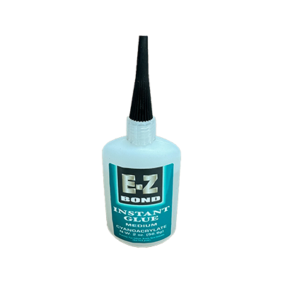 A bottle of Easy Bond Instant Glue with a blue label, designed for medium viscosity and quick curing.