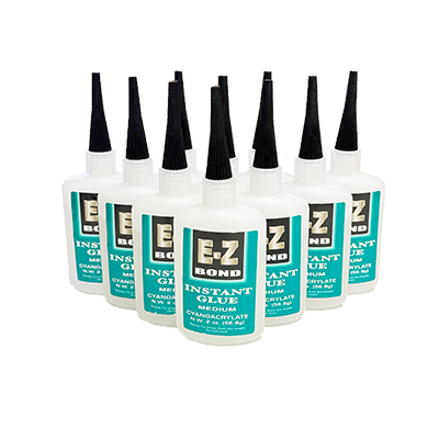 Group of Easy Bond Medium Super Glue bottles arranged for bulk purchase display